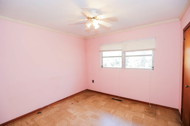 empty room featuring crown molding and ceiling fan