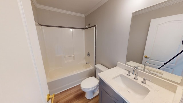 full bathroom with bathing tub / shower combination, vanity, wood-type flooring, ornamental molding, and toilet