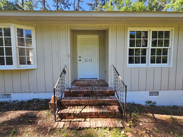 doorway to property featuring crawl space