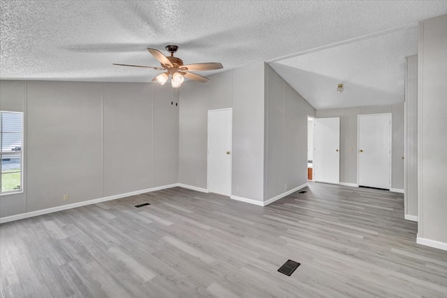 157 Quail Rdg, Moultrie, GA 31788 - empty room with a ceiling fan, a textured ceiling, wood finished floors, baseboards, and vaulted ceiling