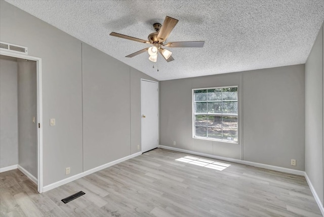 157 Quail Rdg, Moultrie, GA 31788 - unfurnished bedroom featuring a textured ceiling, wood finished floors, vaulted ceiling, ceiling fan, and baseboards