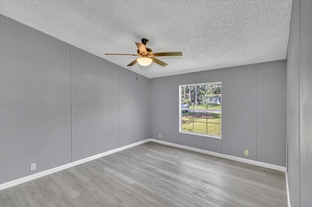 157 Quail Rdg, Moultrie, GA 31788 - empty room with a ceiling fan, a textured ceiling, wood finished floors, and baseboards