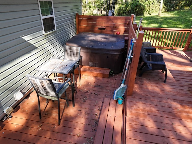 deck featuring a hot tub