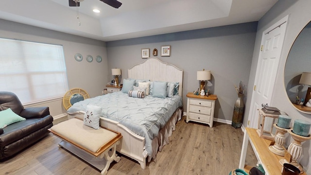 bedroom featuring ceiling fan and light hardwood / wood-style flooring