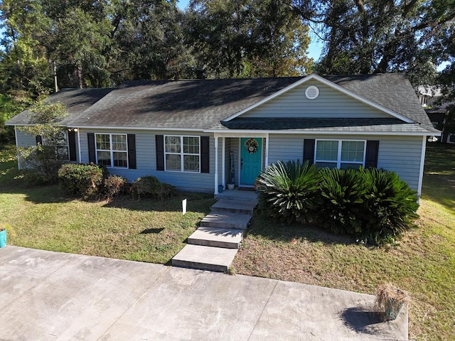 ranch-style home with a front lawn