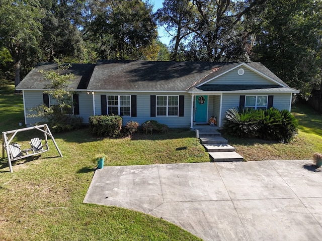 ranch-style home with a front lawn