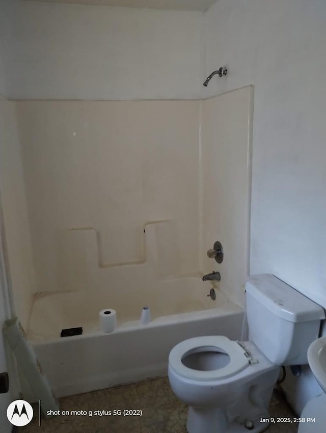 full bathroom featuring bathing tub / shower combination and toilet