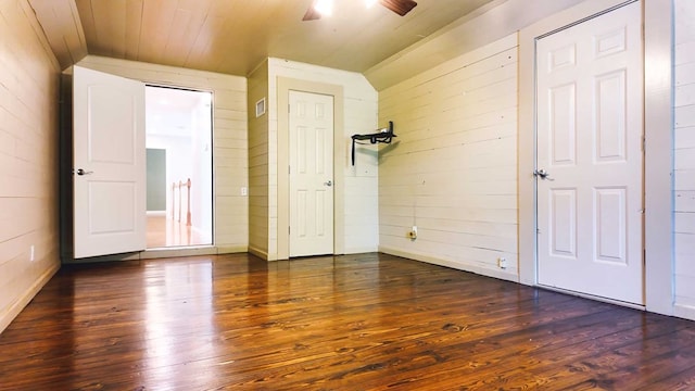 200 Sawgrass Ln, Thomasville, GA 31757 - unfurnished bedroom with lofted ceiling, dark wood-style flooring, wood walls, wooden ceiling, and a ceiling fan