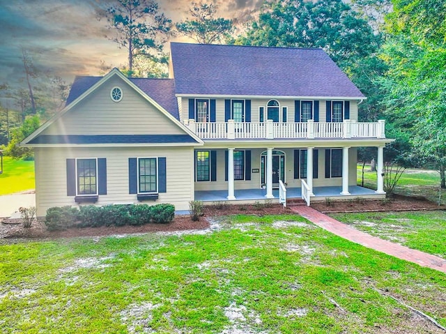 200 Sawgrass Ln, Thomasville, GA 31757 - colonial-style house with a front yard, covered porch, and a balcony