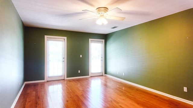 200 Sawgrass Ln, Thomasville, GA 31757 - empty room with wood finished floors and a ceiling fan