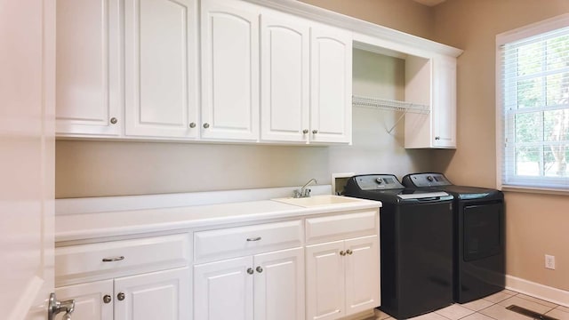 200 Sawgrass Ln, Thomasville, GA 31757 - laundry room featuring cabinet space, separate washer and dryer, and light tile patterned flooring