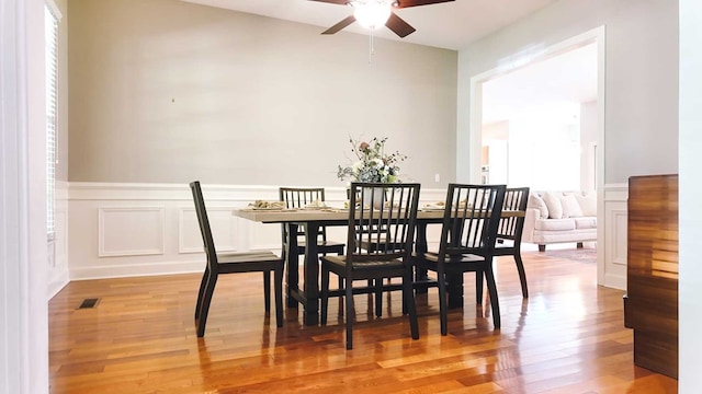 200 Sawgrass Ln, Thomasville, GA 31757 - dining area with a ceiling fan, light wood-style floors, and a wainscoted wall