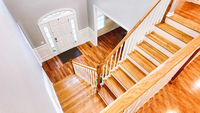 200 Sawgrass Ln, Thomasville, GA 31757 - foyer featuring hardwood / wood-style floors, stairway, wainscoting, and a decorative wall