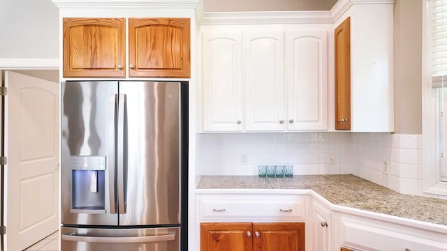 200 Sawgrass Ln, Thomasville, GA 31757 - kitchen with stainless steel refrigerator with ice dispenser, tile countertops, backsplash, and white cabinets