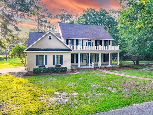 200 Sawgrass Ln, Thomasville, GA 31757 - colonial-style house with covered porch, a yard, a balcony, and roof with shingles