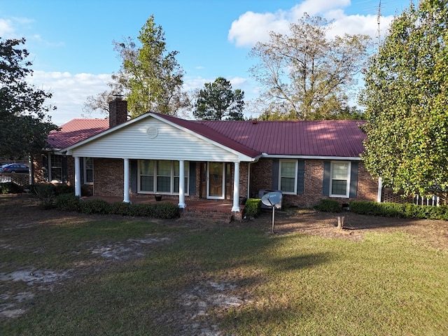 ranch-style house with a front yard and a porch