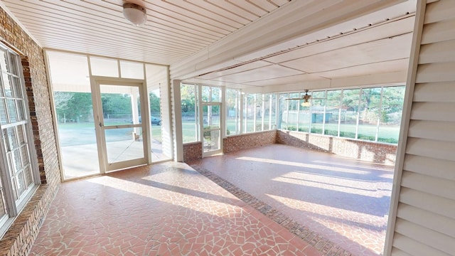 unfurnished sunroom featuring plenty of natural light