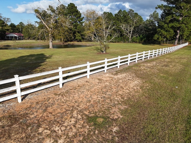 view of yard featuring a water view and a rural view