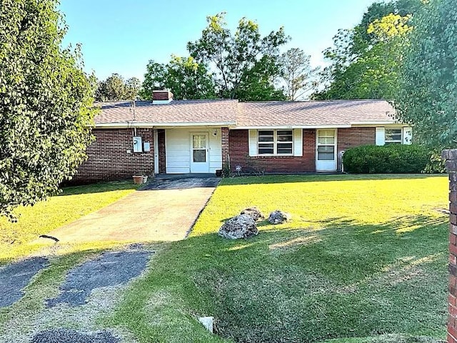786 SW Madison Ln, Cairo, GA 39828 - ranch-style home featuring a front lawn, a chimney, brick siding, and driveway