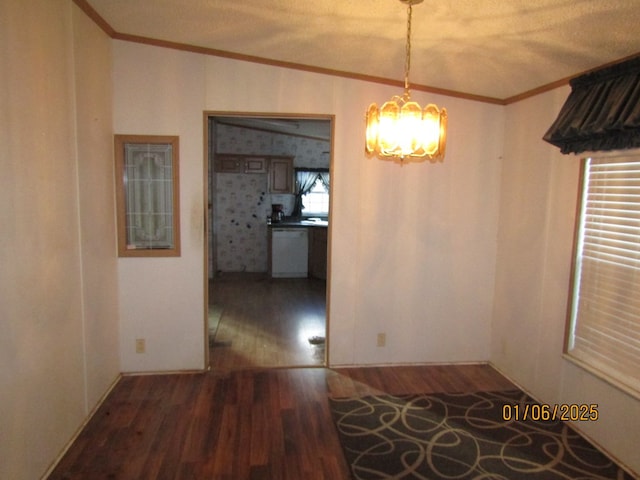 unfurnished dining area with crown molding, dark hardwood / wood-style floors, and an inviting chandelier