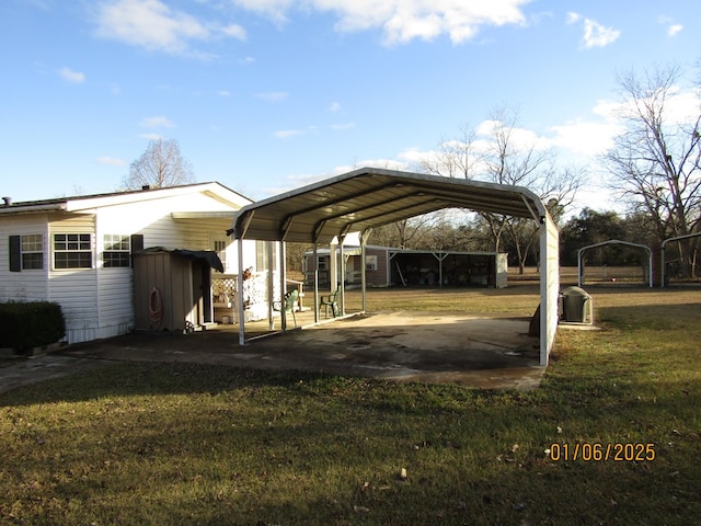 view of vehicle parking with a carport and a lawn