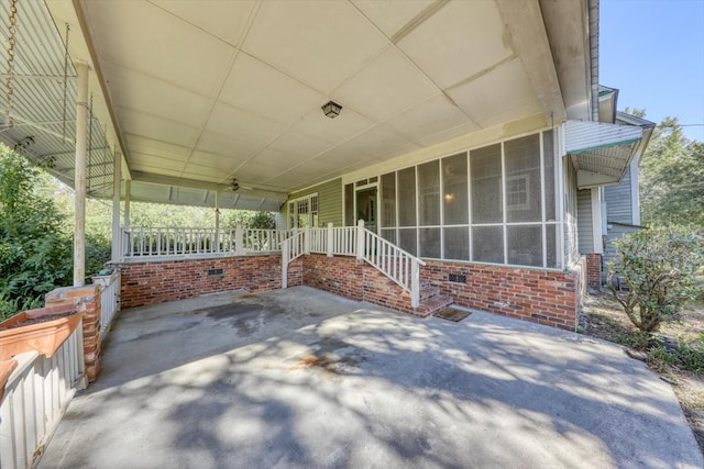 view of patio with a sunroom