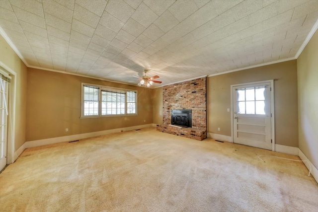 unfurnished living room with ornamental molding, plenty of natural light, light colored carpet, and ceiling fan