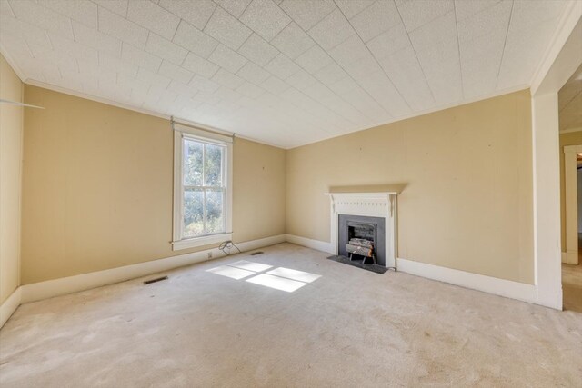 unfurnished living room featuring crown molding, vaulted ceiling, and light colored carpet