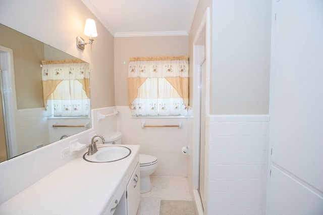 bathroom featuring tile walls, vanity, an enclosed shower, toilet, and crown molding