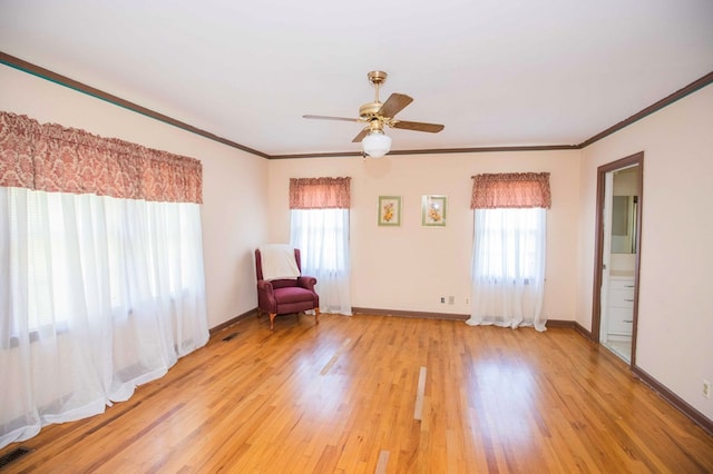 unfurnished room featuring crown molding, ceiling fan, and light hardwood / wood-style floors