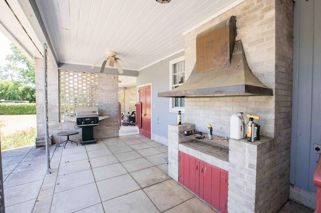 view of patio / terrace with ceiling fan and grilling area