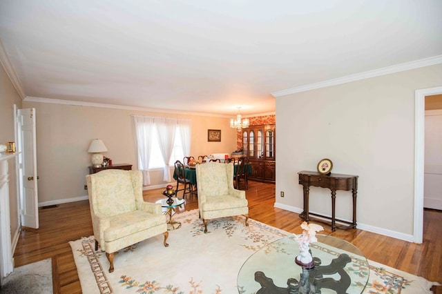 living room featuring hardwood / wood-style floors, a notable chandelier, and ornamental molding