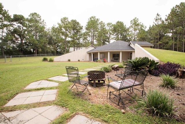 6715 Stewart Rd, Ochlocknee, GA 31773 - view of yard with a fire pit and view of wooded area