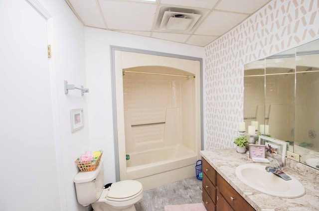 6715 Stewart Rd, Ochlocknee, GA 31773 - full bathroom with vanity, toilet, bathing tub / shower combination, wallpapered walls, and wood finished floors