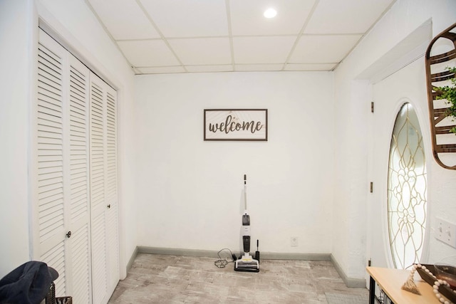 6715 Stewart Rd, Ochlocknee, GA 31773 - entryway with a drop ceiling, baseboards, and light wood-type flooring
