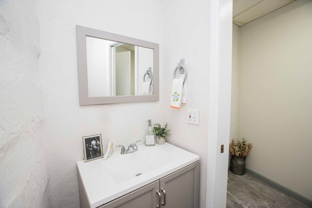 6715 Stewart Rd, Ochlocknee, GA 31773 - bathroom with wood finished floors and vanity