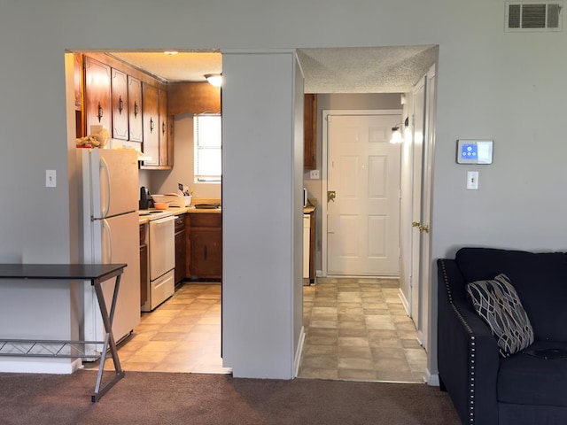 1197 Jo Ree St, Valdosta, GA 31601 - kitchen with white appliances and baseboards
