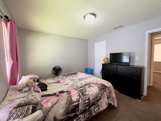 1197 Jo Ree St, Valdosta, GA 31601 - bedroom with carpet flooring and a textured ceiling