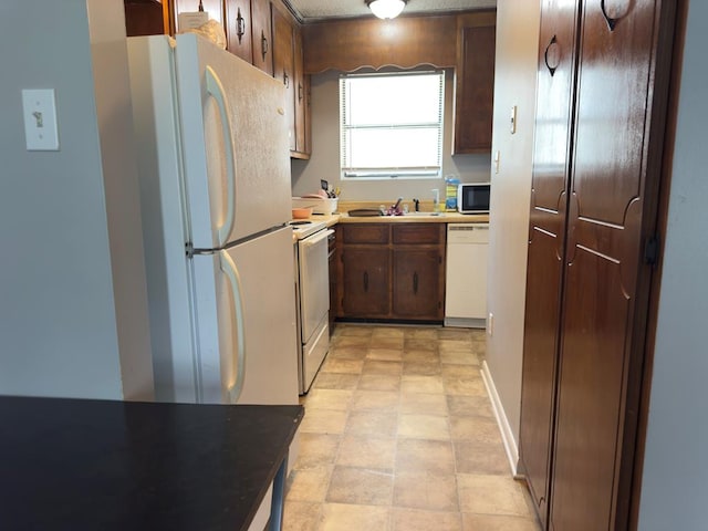 1197 Jo Ree St, Valdosta, GA 31601 - kitchen featuring white appliances and light countertops