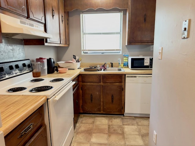 1197 Jo Ree St, Valdosta, GA 31601 - kitchen featuring white appliances, under cabinet range hood, light countertops, and dark brown cabinets