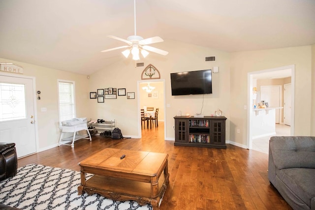 living room with vaulted ceiling, ceiling fan, and dark hardwood / wood-style flooring