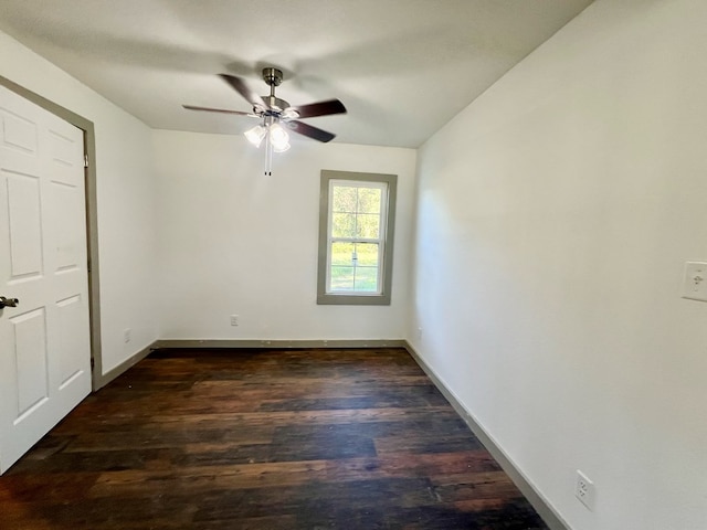 unfurnished bedroom with ceiling fan and dark hardwood / wood-style flooring