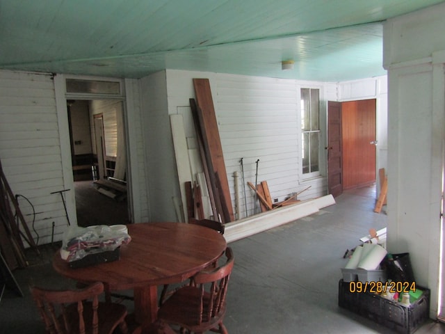 dining area with wood walls