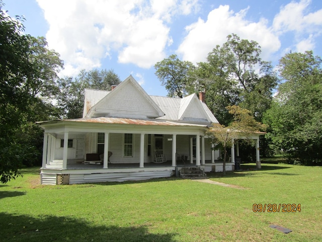 exterior space with a porch and a front lawn