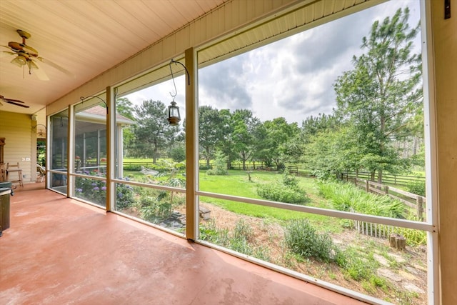 233 Fox Meadow Ln, Thomasville, GA 31757 - unfurnished sunroom featuring ceiling fan and view of wooded area