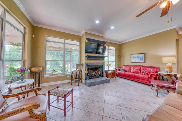 233 Fox Meadow Ln, Thomasville, GA 31757 - living area featuring a fireplace with raised hearth, ornamental molding, tile patterned floors, ceiling fan, and healthy amount of natural light