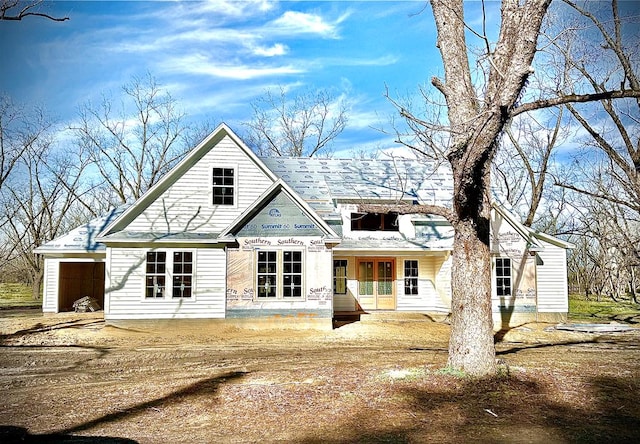 back of property featuring french doors