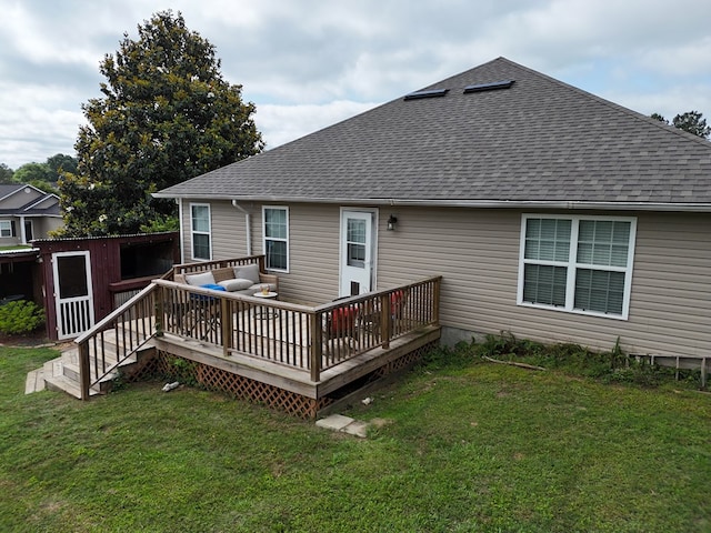106 Hayden Way, Thomasville, GA 31792 - rear view of house featuring a shingled roof, a wooden deck, a yard, and an outdoor living space