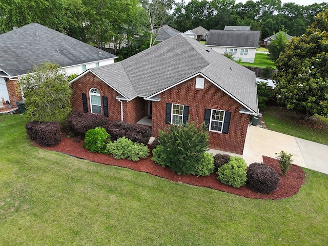 106 Hayden Way, Thomasville, GA 31792 - view of front of property featuring brick siding, roof with shingles, and a front lawn