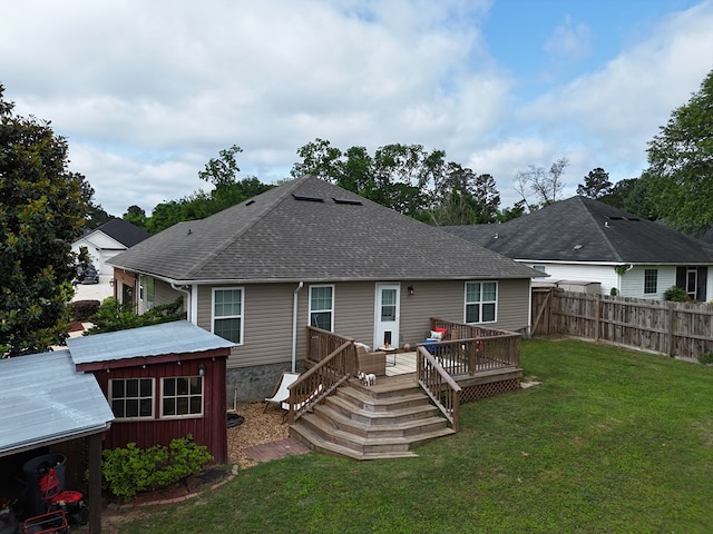 106 Hayden Way, Thomasville, GA 31792 - rear view of property featuring a shingled roof and a wooden deck